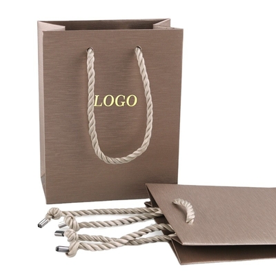Buy Luxury Retail Gift Paper Bags Foldable Waterproof Shopping Bag With Gold Hot Foil online manufacture